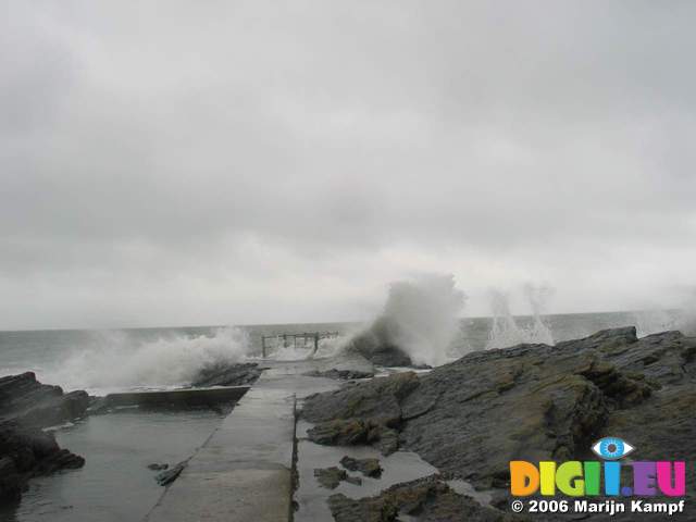 15967 Waves crashing over rocky beach